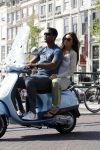 Amstedam 25 april 2007
Patrick Kluivert met fuck the paparazzi t shirt en zijn zwangere vriendin Rossana Lima op vespa scooter door amsterdam.