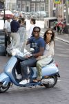 Amstedam 25 april 2007
Patrick Kluivert met fuck the paparazzi t shirt en zijn zwangere vriendin Rossana Lima op vespa scooter door amsterdam.