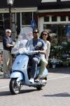 Amstedam 25 april 2007
Patrick Kluivert met fuck the paparazzi t shirt en zijn zwangere vriendin Rossana Lima op vespa scooter door amsterdam.