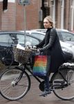 Amsterdam 19 april 2013
Ajax speler Christian Poulsen met zijn vrouw op de cornelis schuytstraat.
Peter Smulders bv