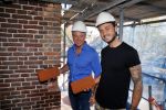 Amsterdam 15 april 2015
Dave en Dries Roelvink metselen een steen met daarop hun naam in de Westertoren. Dave heeft een tatoo van de westertoren op zijn arm staan.