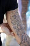Amsterdam 15 april 2015
Dave en Dries Roelvink metselen een steen met daarop hun naam in de Westertoren. Dave heeft een tatoo van de westertoren op zijn arm staan.