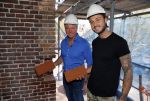 Amsterdam 15 april 2015
Dave en Dries Roelvink metselen een steen met daarop hun naam in de Westertoren. Dave heeft een tatoo van de westertoren op zijn arm staan.