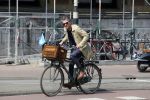 Amsterdam 23 april 2015  
Jos v Raak op de fiets bij ihet Paleis op de Dam.