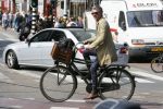 Amsterdam 23 april 2015  
Jos v Raak op de fiets bij ihet Paleis op de Dam.