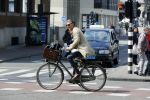 Amsterdam 23 april 2015  
Jos v Raak op de fiets bij ihet Paleis op de Dam.
