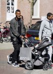 Amsterdam 14 april 2015
Sunnery James en zijn moeder met vrienden achter de kinderwagen op de cornelis schuytstraat