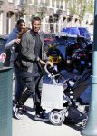 Amsterdam 14 april 2015
Sunnery James en zijn moeder met vrienden achter de kinderwagen op de cornelis schuytstraat