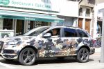 Amsterdam 23 april 2016 
Gordon met zijn audi Q7 in camouflage kleuren in Amsterdam zuid.