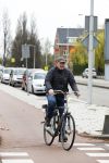 Amsterdam 18 april 2016 
Henk Poort op de fiets in Amsterdam.