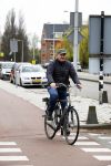 Amsterdam 18 april 2016 
Henk Poort op de fiets in Amsterdam.