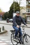 Amsterdam 18 april 2016 
Henk Poort op de fiets in Amsterdam.