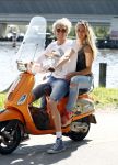 Amsterdam 7 mei 2016 
Michelle van Nood en haar vriend Koen Brouwer op hun vespa scooter. Michelle en Koen zijn de populaire deelnemers aan het RTL programma SOS survival of the Sexes