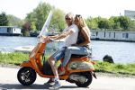 Amsterdam 7 mei 2016 
Michelle van Nood en haar vriend Koen Brouwer op hun vespa scooter. Michelle en Koen zijn de populaire deelnemers aan het RTL programma SOS survival of the Sexes