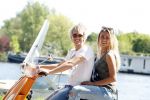 Amsterdam 7 mei 2016 
Michelle van Nood en haar vriend Koen Brouwer op hun vespa scooter. Michelle en Koen zijn de populaire deelnemers aan het RTL programma SOS survival of the Sexes
