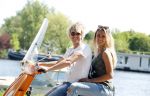 Amsterdam 7 mei 2016 
Michelle van Nood en haar vriend Koen Brouwer op hun vespa scooter. Michelle en Koen zijn de populaire deelnemers aan het RTL programma SOS survival of the Sexes