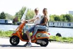 Amsterdam 7 mei 2016 
Michelle van Nood en haar vriend Koen Brouwer op hun vespa scooter. Michelle en Koen zijn de populaire deelnemers aan het RTL programma SOS survival of the Sexes