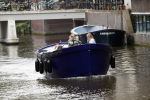 Amsterdam 13 mei 2017 
Prins Berenhard jr aan het varen in zijn waterdream sloep (boot) met zijn dochter Isabella en haar vriendinnen op de grachten van Amsterdam. Tijdens het varen regent het behoorlijk.