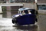 Amsterdam 13 mei 2017 
Prins Berenhard jr aan het varen in zijn waterdream sloep (boot) met zijn dochter Isabella en haar vriendinnen op de grachten van Amsterdam. Tijdens het varen regent het behoorlijk.