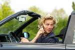 Den Haag16 mei 2002
Antonie Kamerling met gsm achter het stuur van zijn cabrio