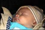 Amsterdam 7 mei 2003
Peter Faber met zijn vrouw en zoontje achter de kinderwagen