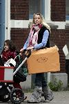 Amsterdam 10 mei 2005
Maria Kooistra zwanger op cornelis schuytstraat met gsm   en speciale laarzen