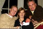 Castricum 27 november 2003
Nicky LaCroix en Frank la Croix met hun zoontje Oliver en met opa Henny Huisman.