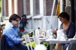 Amsterdam 9 september 2013
Pierre Bokma op terras met ......
