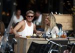 Amsterdam 12 september 2016 
Tim Douwsma en zijn vriendin Jessie Jazz Vuijk op terras en op de scooter