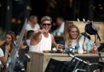Amsterdam 12 september 2016 
Tim Douwsma en zijn vriendin Jessie Jazz Vuijk op terras en op de scooter