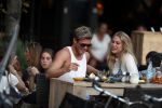 Amsterdam 12 september 2016 
Tim Douwsma en zijn vriendin Jessie Jazz Vuijk op terras en op de scooter