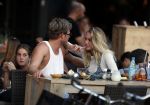 Amsterdam 12 september 2016 
Tim Douwsma en zijn vriendin Jessie Jazz Vuijk op terras en op de scooter