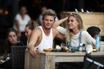 Amsterdam 12 september 2016 
Tim Douwsma en zijn vriendin Jessie Jazz Vuijk op terras en op de scooter