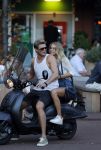 Amsterdam 12 september 2016 
Tim Douwsma en zijn vriendin Jessie Jazz Vuijk op terras en op de scooter