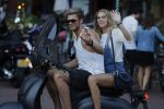 Amsterdam 12 september 2016 
Tim Douwsma en zijn vriendin Jessie Jazz Vuijk op terras en op de scooter