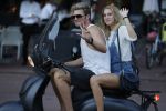 Amsterdam 12 september 2016 
Tim Douwsma en zijn vriendin Jessie Jazz Vuijk op terras en op de scooter