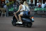 Amsterdam 12 september 2016 
Tim Douwsma en zijn vriendin Jessie Jazz Vuijk op terras en op de scooter