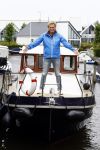 Henny Huisman op zijn boot