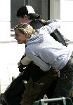 Amsterdam 3 september 2005
Johnny de Mol met zijn nieuwe vriendin op scooter
