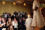 Amsterdam 11 september 2006
Modeshow Frans Molenaar in het Amstel Hotel.  Damielle Overgaag en janine v d Ende kijken naar trouwjurk