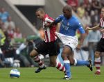 Eindhoven, 17 September 2006
Kompetitiewedstrijd PSV-Feyenoord, eindstand 2-1
Diego Tardelli zijn eerste wedstrijd voor PSV in duel met Andre Bahia