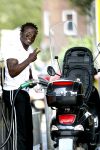 Amsterdam 11 augustus 2007
Regilio Tuur met zijn vespa scooter aan het tanken.