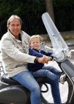 Amsterdam 31 augustus 2013
Patrick Huisman met zoontje op vespa scooter