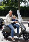 Amsterdam 31 augustus 2013
Patrick Huisman met zoontje op vespa scooter