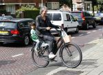 Amsterdam 31 augustus 2013
Ruud en Aafke de Wild met hun kinderen boodschappen aan het doen op de fiets.