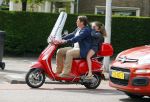 Amsterdam 26 augustus 2015 
Martijn Krabbe met dochter Jasmijn op zijn vespa scooter