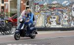 Amsterdam 2 september 2016 
Hans Jorritsma met zijn zoon op een vespa scooter