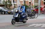 Amsterdam 2 september 2016 
Hans Jorritsma met zijn zoon op een vespa scooter