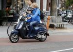 Amsterdam 2 september 2016 
Hans Jorritsma met zijn zoon op een vespa scooter