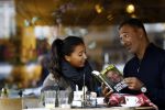 Amsterdam 10 augustus 2016
Ruud Gullit samen met zijn dochter Joelle op terras. Ruud bekijkt samen met haar zijn nieuwe boek.